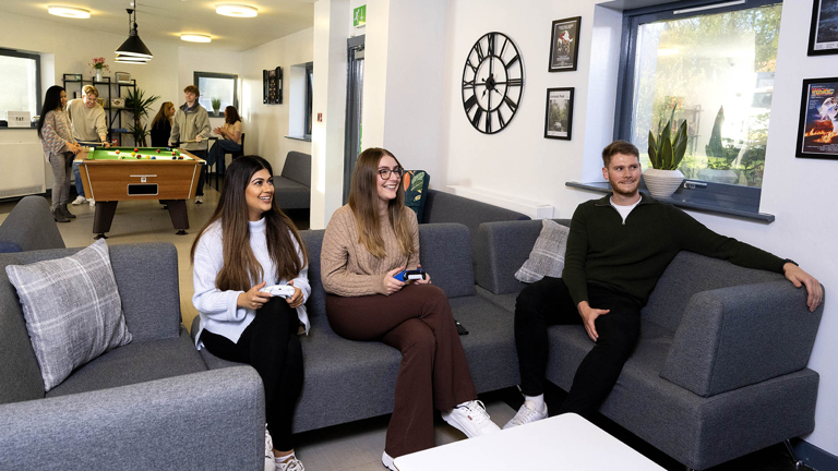 students sat on sofas in roeburn common room