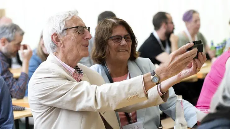 Two graduates taking a selfie