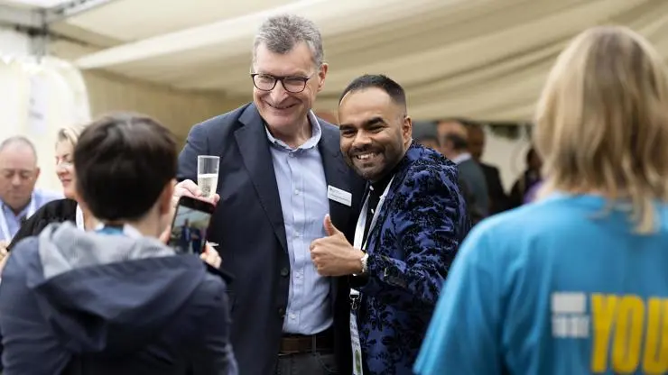 UCLan Vice-Chancellor, Professor Graham Baldwin, with a graduate