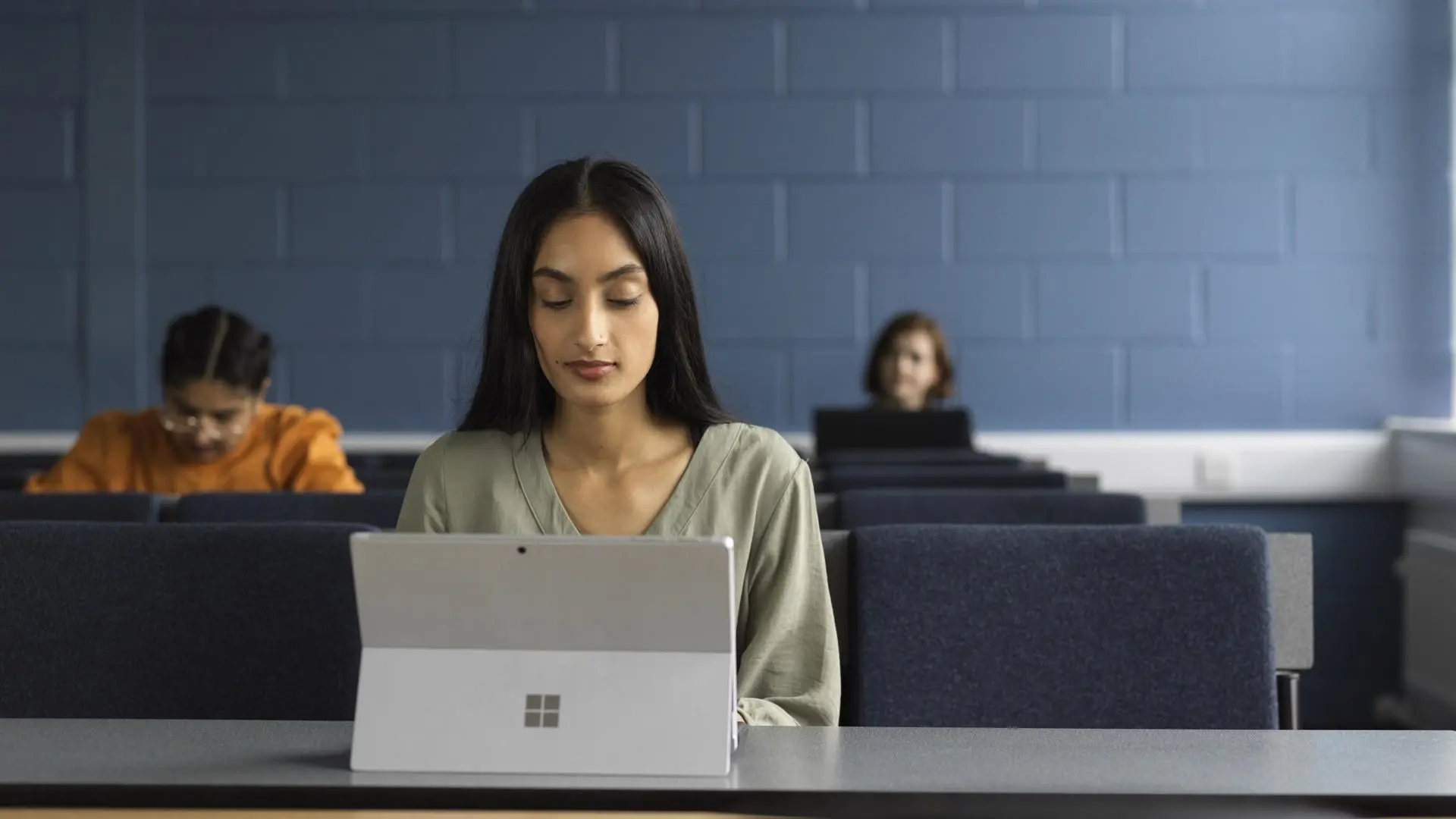 business management student working on their laptop