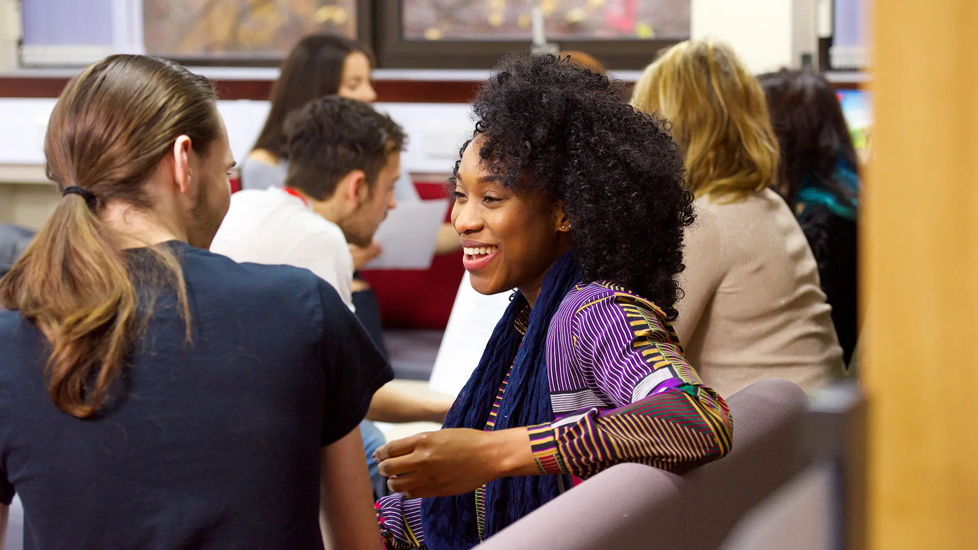 student smiling and talking