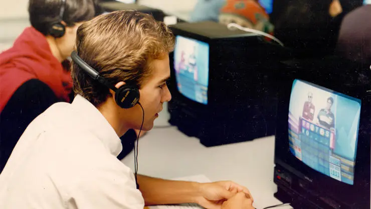 Journalism students using equipment 