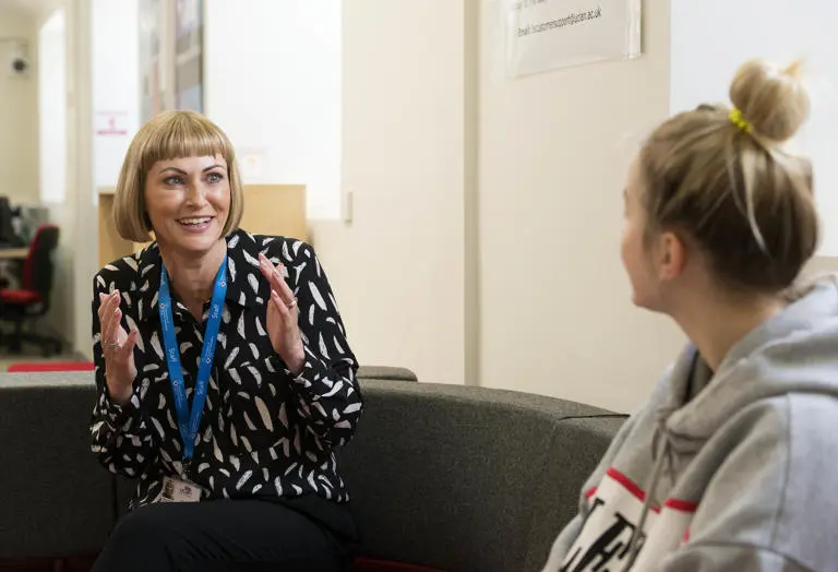 Westlakes support staff chatting to a student