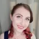 Headshot of Charlotte looking into the camera