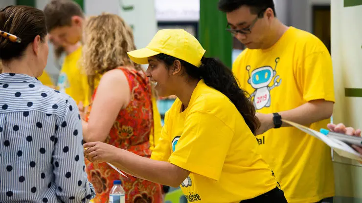 Event staff registering visitors at Lancashire Science Festival