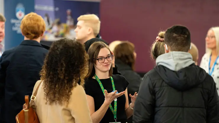 Staff assisting visitors at an Open Day